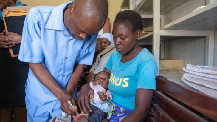 child getting malaria vaccine