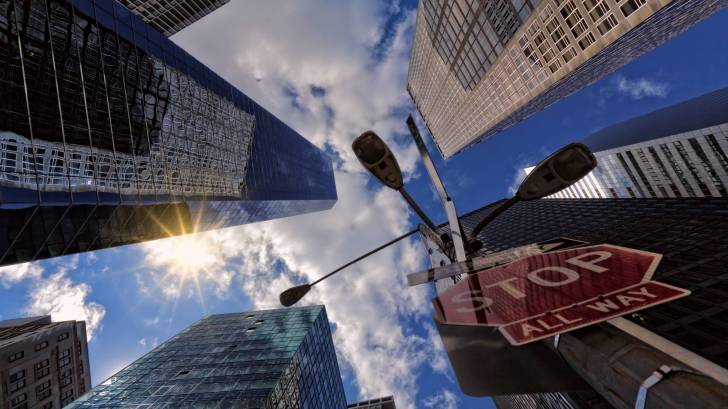 city scape with stop sign