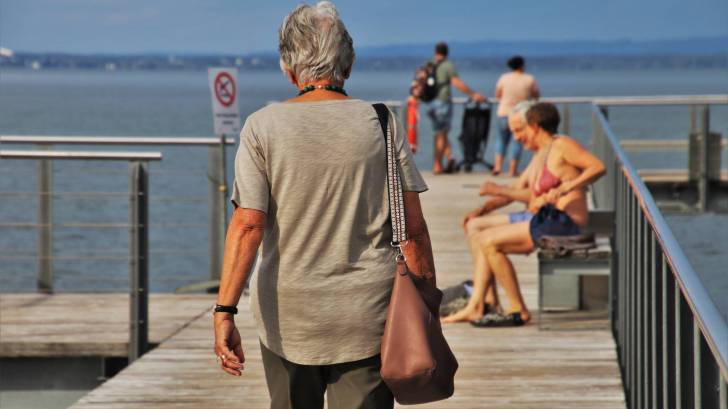 older people on a dock enjoying the day