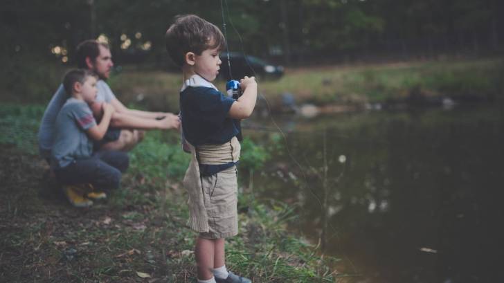 fishing in a pond with dad