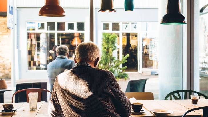 older men sitting in a cafe