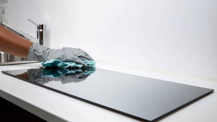 cleaning the surface of a kitchen