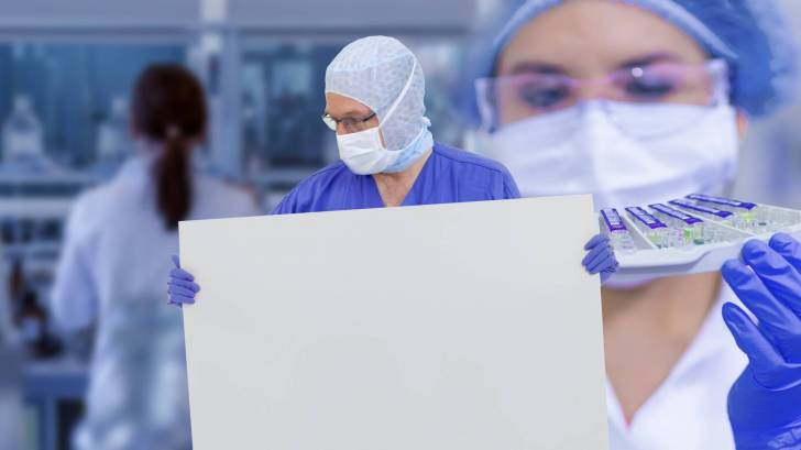 lab workers getting ready for clinical trial