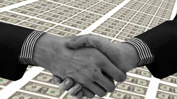 hand shake over money