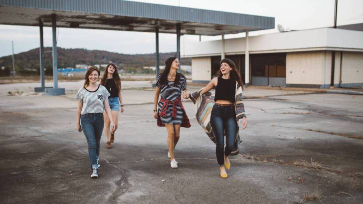 girls walking strong together
