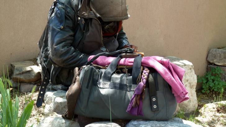 homeless man and his bag