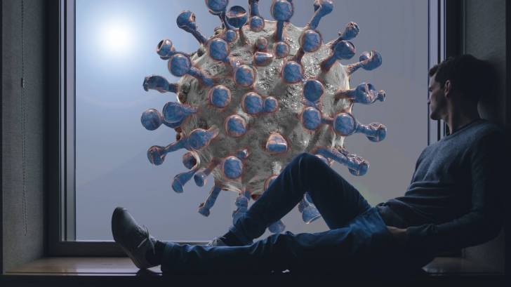 man sitting in a window, coronavirus outside
