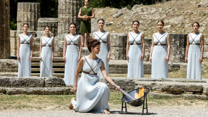 olympic torch being lit in athens greece