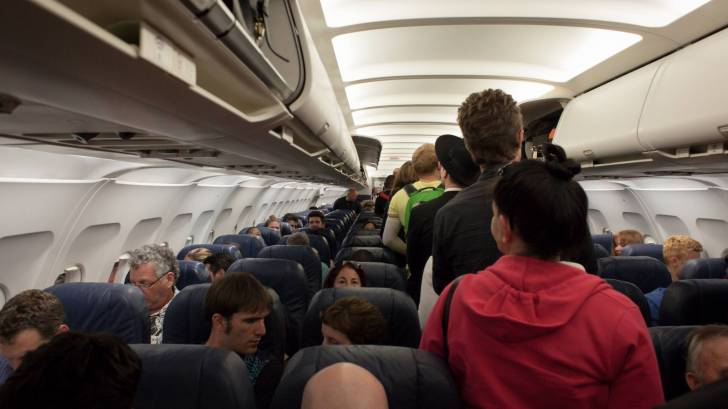 crowded airplane prior to covid