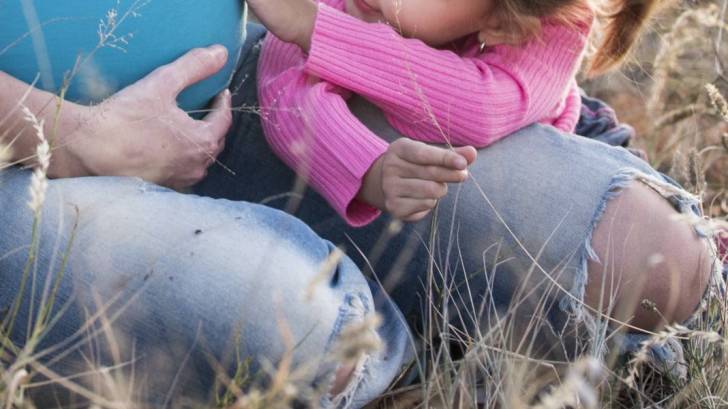 pregnant belly with toddler