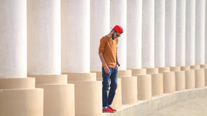 young man looking at shoes 