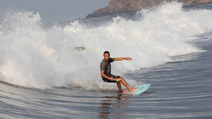 surfer riding the waves freely
