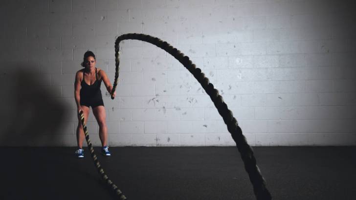woman training with ropes to get stronger