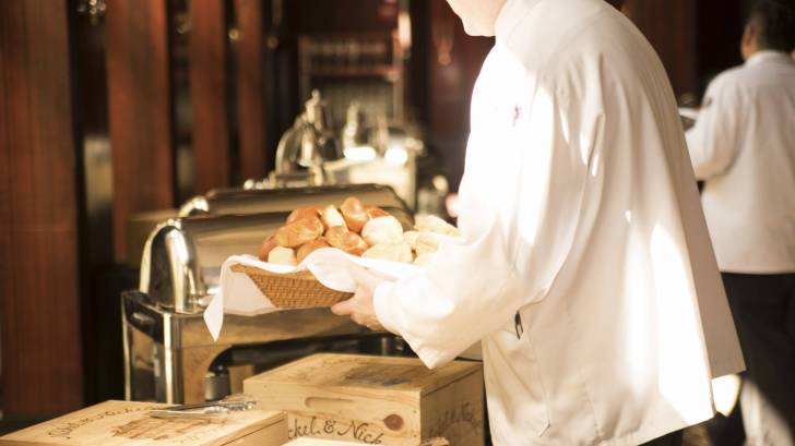 waiter serving bread