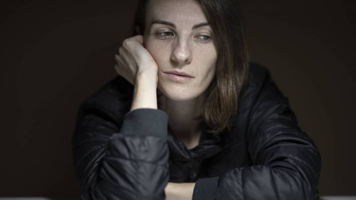 woman not feeling well after covid illness