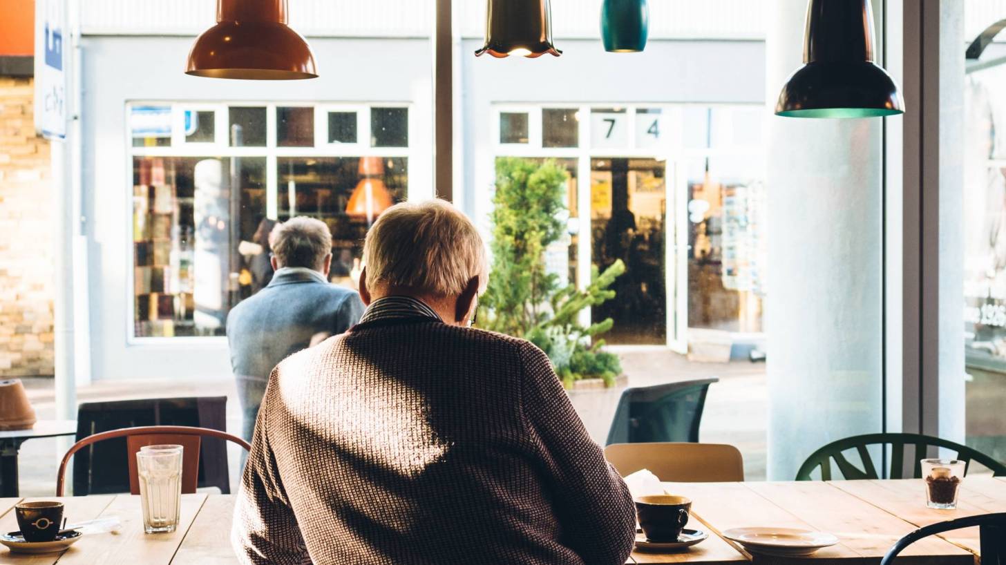 older men sitting in a cafe