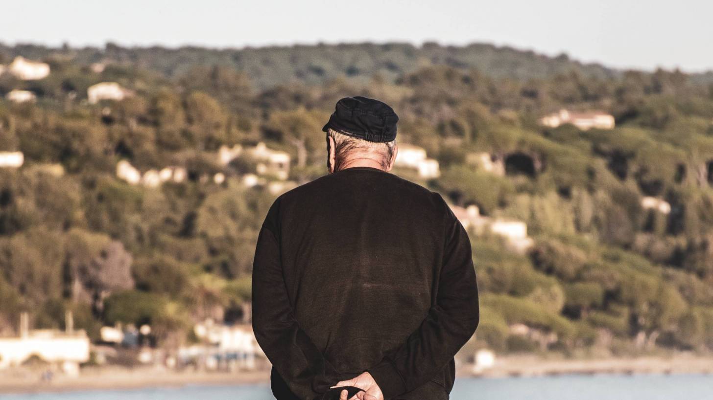 older man contemplating