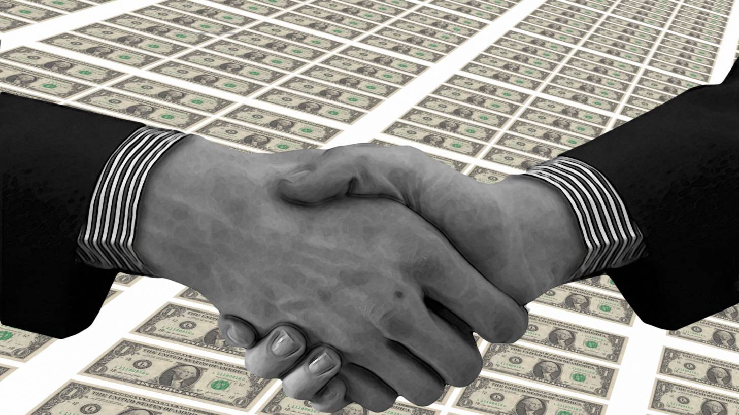 hand shake over money