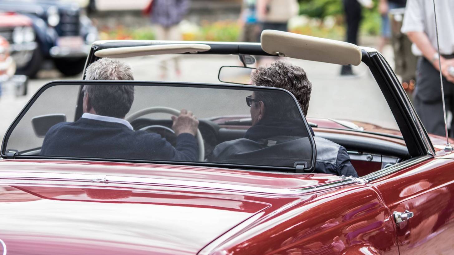 convertible car driving up 