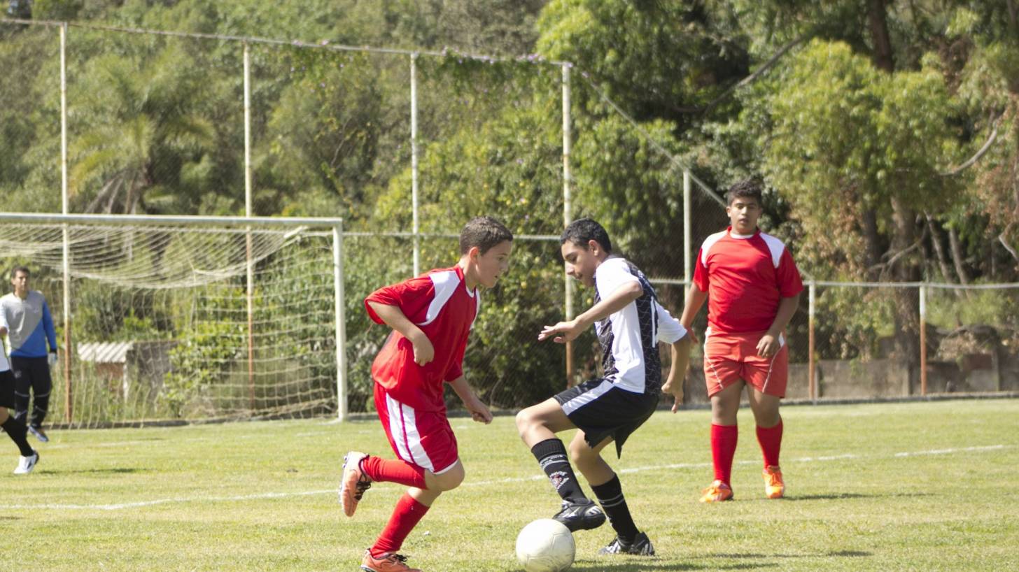 teens palying soccer