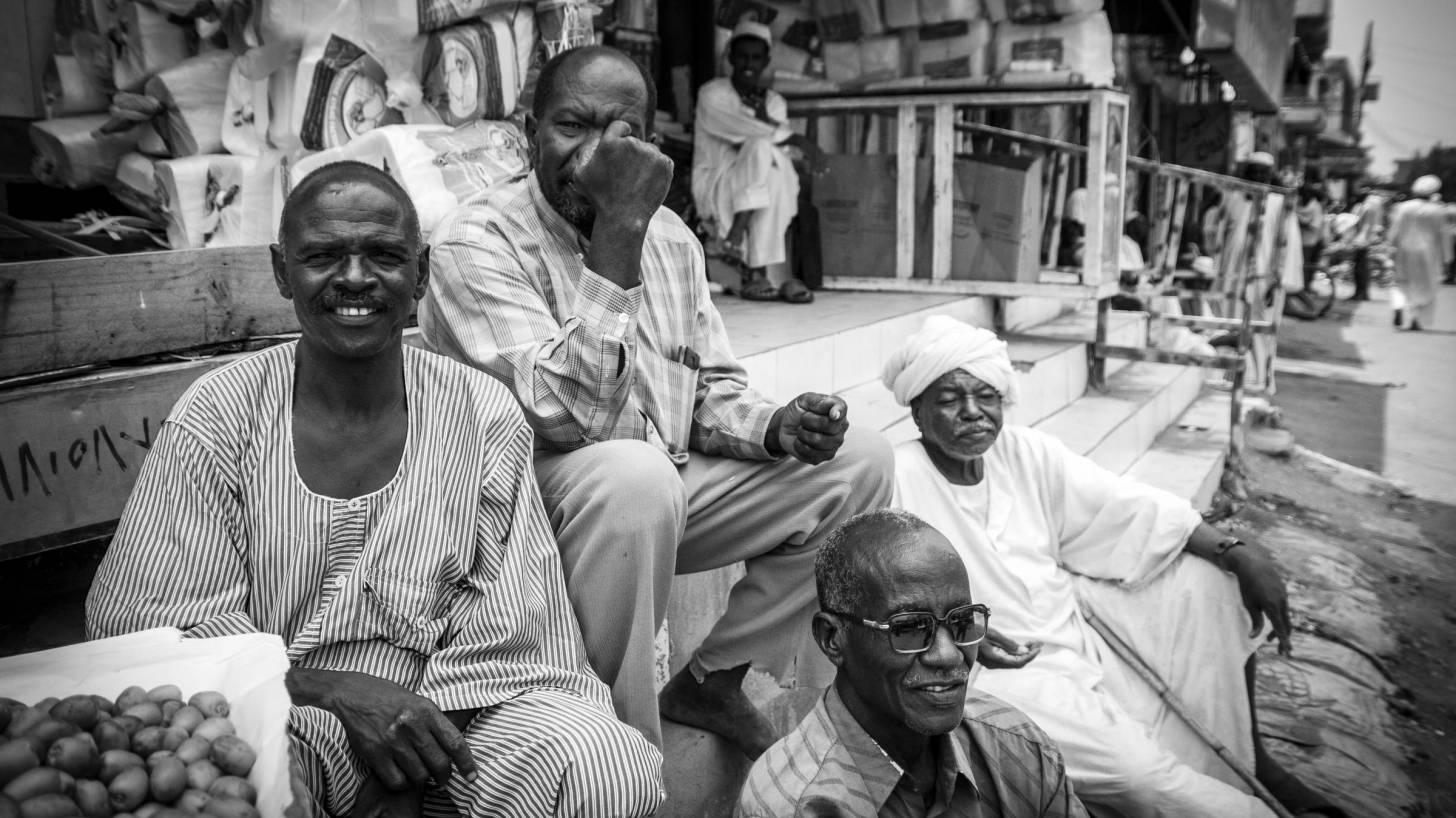 people in sudan talking and having fun