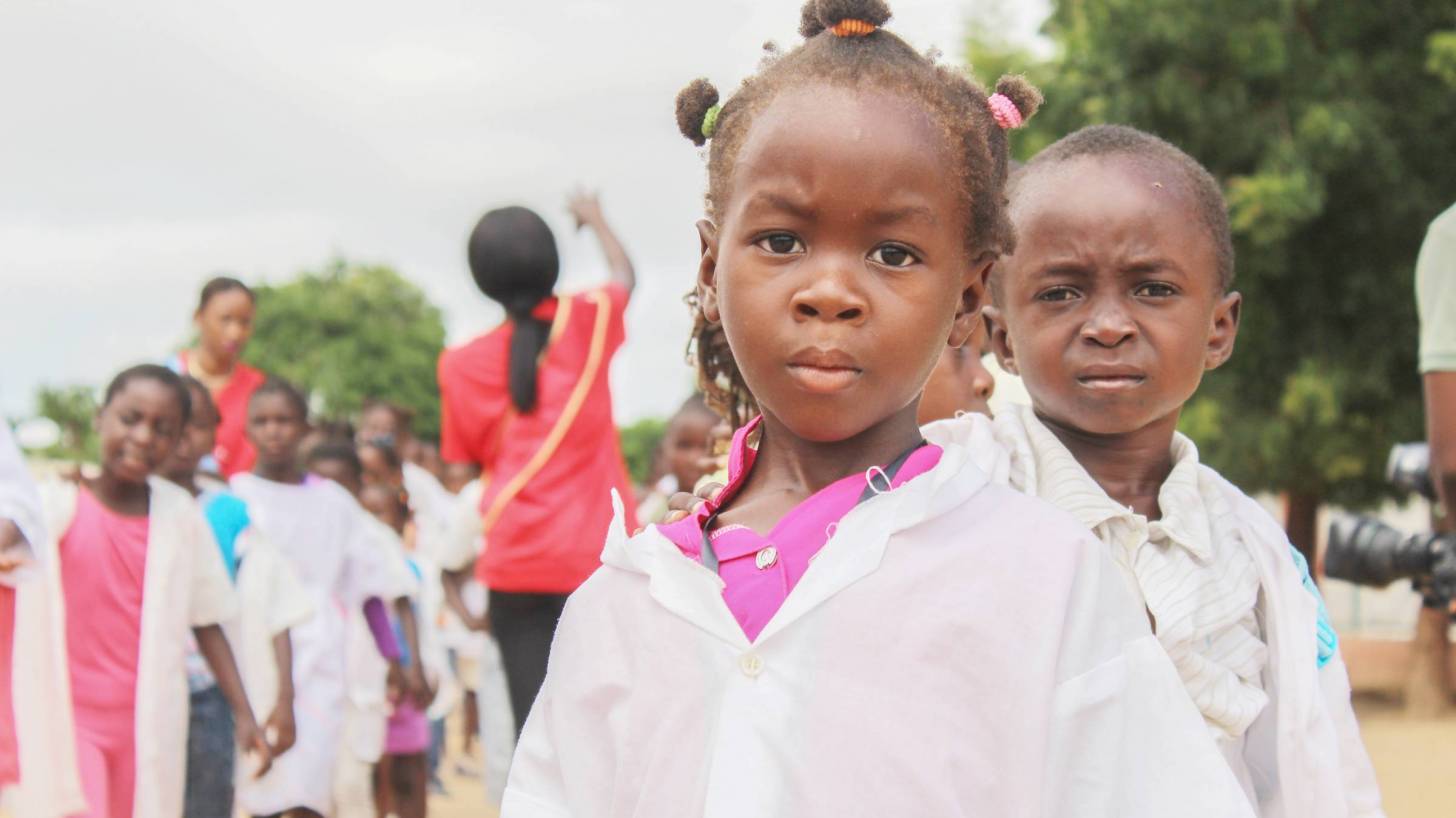 young children in lab coats waiting to be tested
