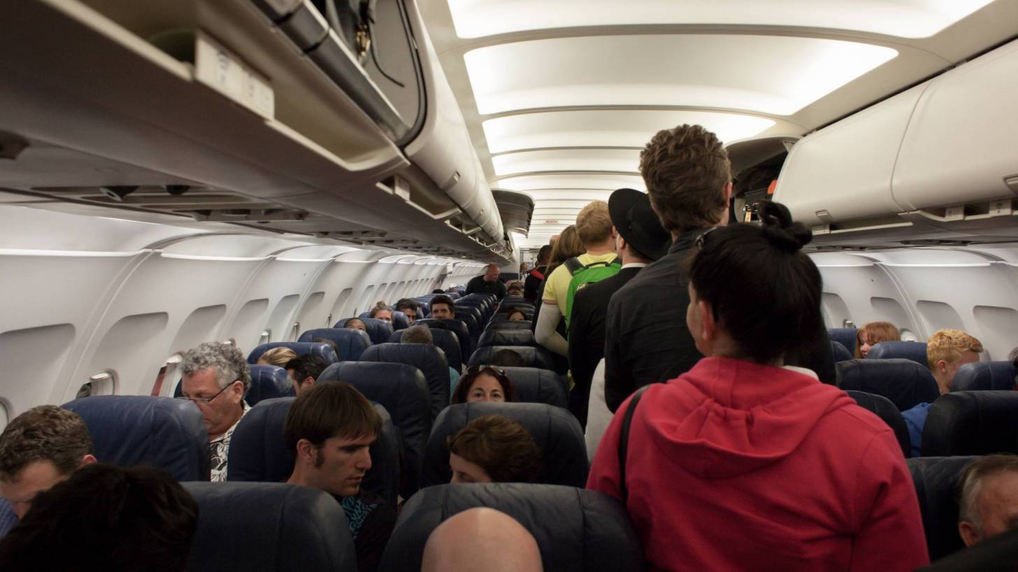 crowded airplane prior to covid