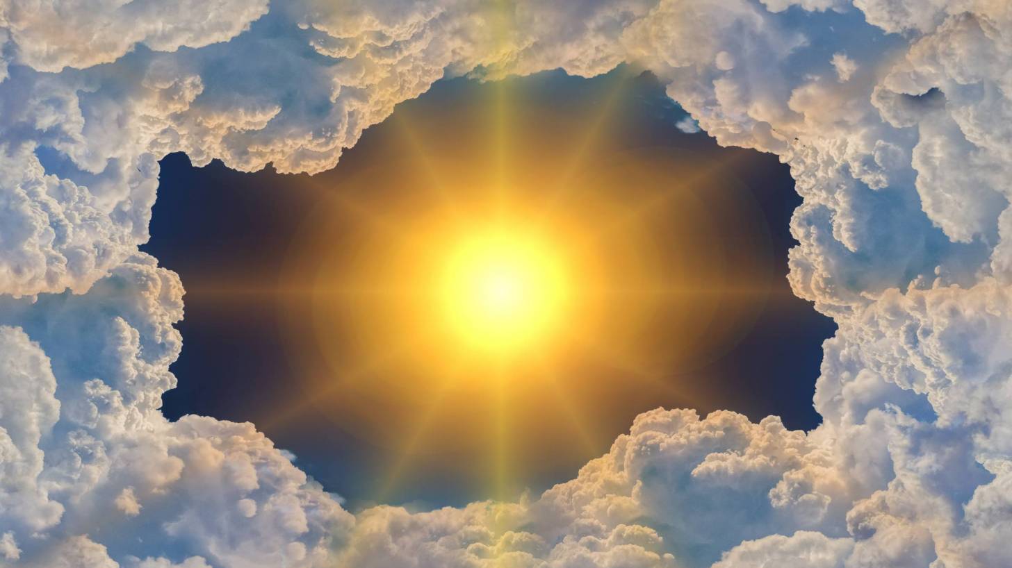 hot sun poking thru clouds