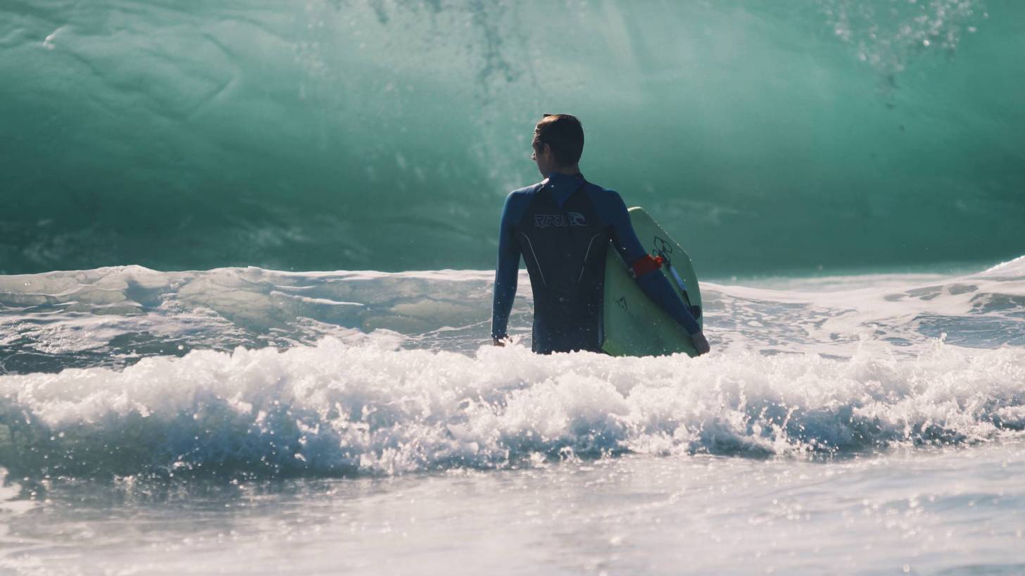 surfer with big waves heading his way