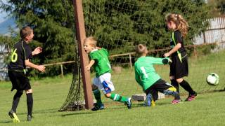children playing soccer happy