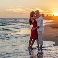 couple hugging on the beach