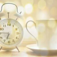 alarm clock and cup of coffee