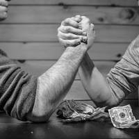 men arm wrestling