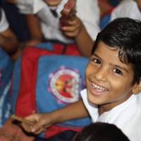 young healthy happy boy in school