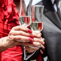 couple celebrating with champagne flutes