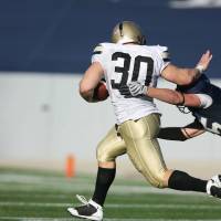 football player stiff arming another player
