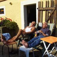 older men sitting in the sun