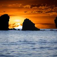 sun setting over water