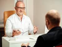 doctor speaking with patient